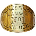 LNWR armband L&NWR OUTSIDE PORTER NO1 LLANDUDNO. Oval hand engraved brass measuring 4.5in x 3.5in.