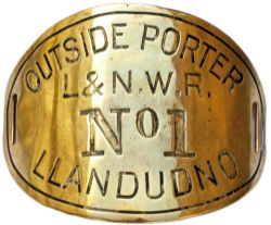 LNWR armband L&NWR OUTSIDE PORTER NO1 LLANDUDNO. Oval hand engraved brass measuring 4.5in x 3.5in.