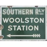 Southern Railway enamel sign WOOLSTON STATION with feathered arrow beneath. Double sided, both sides