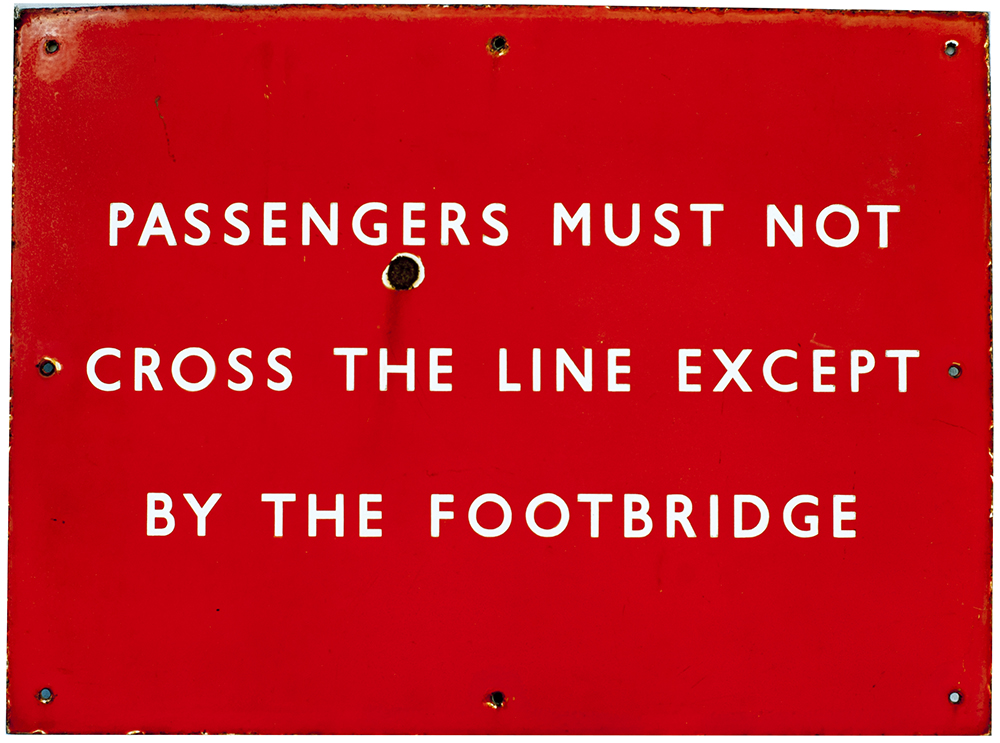 BR(NE) enamel sign PASSENGERS MUST NOT CROSS THE LINE EXCEPT BY THE FOOTBRIDGE. In good condition