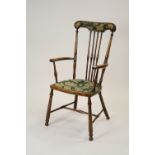 A stained beech framed open armchair,