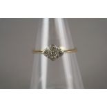 An Art Deco diamond cluster ring, the yellow metal shank stamped '18ct Plat', ring size V, weight 2.