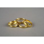 Five 22ct gold wedding bands (one split), together with a yellow metal plain polished wedding band,