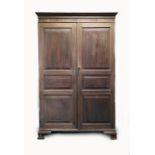 A George III mahogany gentleman's two door wardrobe, Channel Islands, circa 1800,