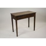 A George III oak and mahogany crossbanded side table with frieze drawer and lion mask ring handles