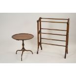 A Victorian walnut framed towel rail and a reproduction dished top circular occasional table in