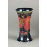 A Moorcroft trumpet vase decorated in the Pomegranate pattern, impressed and painted marks, 15.