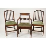 A set of four George III style mahogany rail back dining chairs,