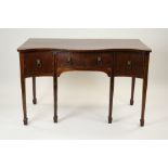 A George III style crossbanded mahogany serpentine front sideboard with bowed central drawer