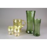 A group of three dark green Stuart ribbed vases,