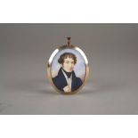 An early 19th century portrait miniature on ivory, depicting a young gentleman,