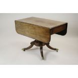 An early 19th century mahogany Pembroke table,