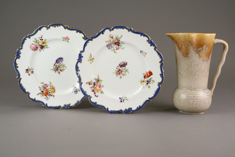 A set of twelve English porcelain cabinet plates decorated with flowers in polychrome,