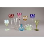 A selection of late 19th/early 20th century coloured glassware including cranberry wines and Art