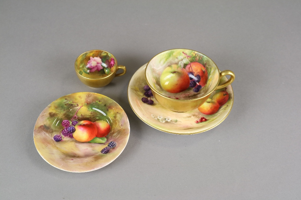 A Royal Worcester florally painted miniature teacup, a Royal Worcester fruit-painted side plate, 11.