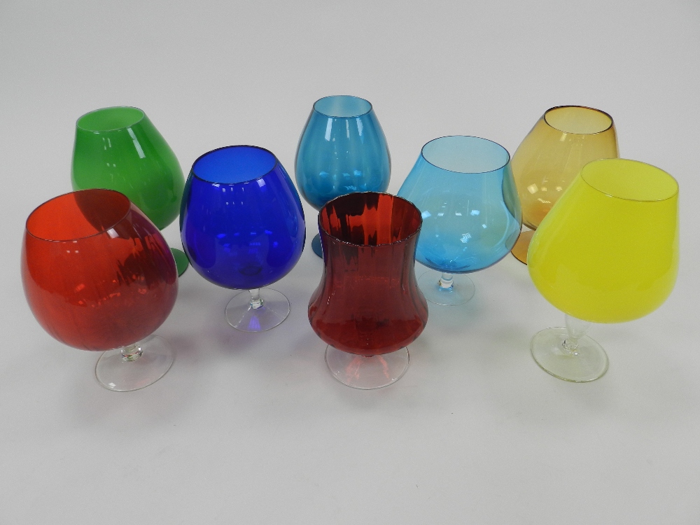 Eight various decorative coloured glass oversized decorative glasses,