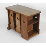 A 20th century Gothic style nest of oak occasional tables,