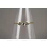 A three stone graduated diamond ring,