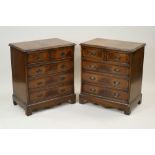 A pair of George III style crossbanded mahogany small chests of two short and three long cockbeaded