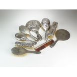 A collection of silver mounted dressing table wares