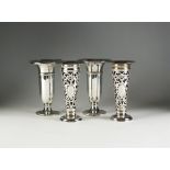 Two pairs of silver vases