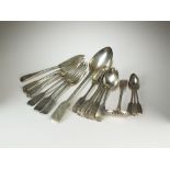 A collection of silver flatware