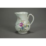 A Worcester porcelain low bellied sparrow beak jug painted in polychrome with flowers,