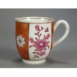 A Worcester porcelain coffee cup painted with a scarlet Japan style pattern with puce flowers,