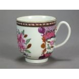 A Worcester porcelain famille rose coffee cup painted with flowers within puce cross-hatch borders,