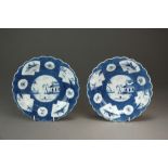 A pair of small Caughley powder blue lobed plates painted in the Fan Panelled Landscape pattern,