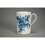 A Caughley porcelain cylindrical mug transfer-printed in the Three Flowers pattern, circa 1778,