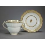 A Worcester porcelain twin handled chocolate cup and saucer, circa 1790-95, of ogee form,
