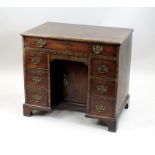 A George III mahogany knee-hole desk,