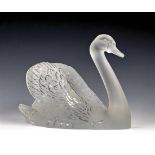 A Lalique figure of a swan, post war, clear unfrosted, stylistically modelled with head down,