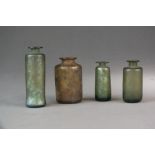 A small grouping of Roman glass bottles, various forms,