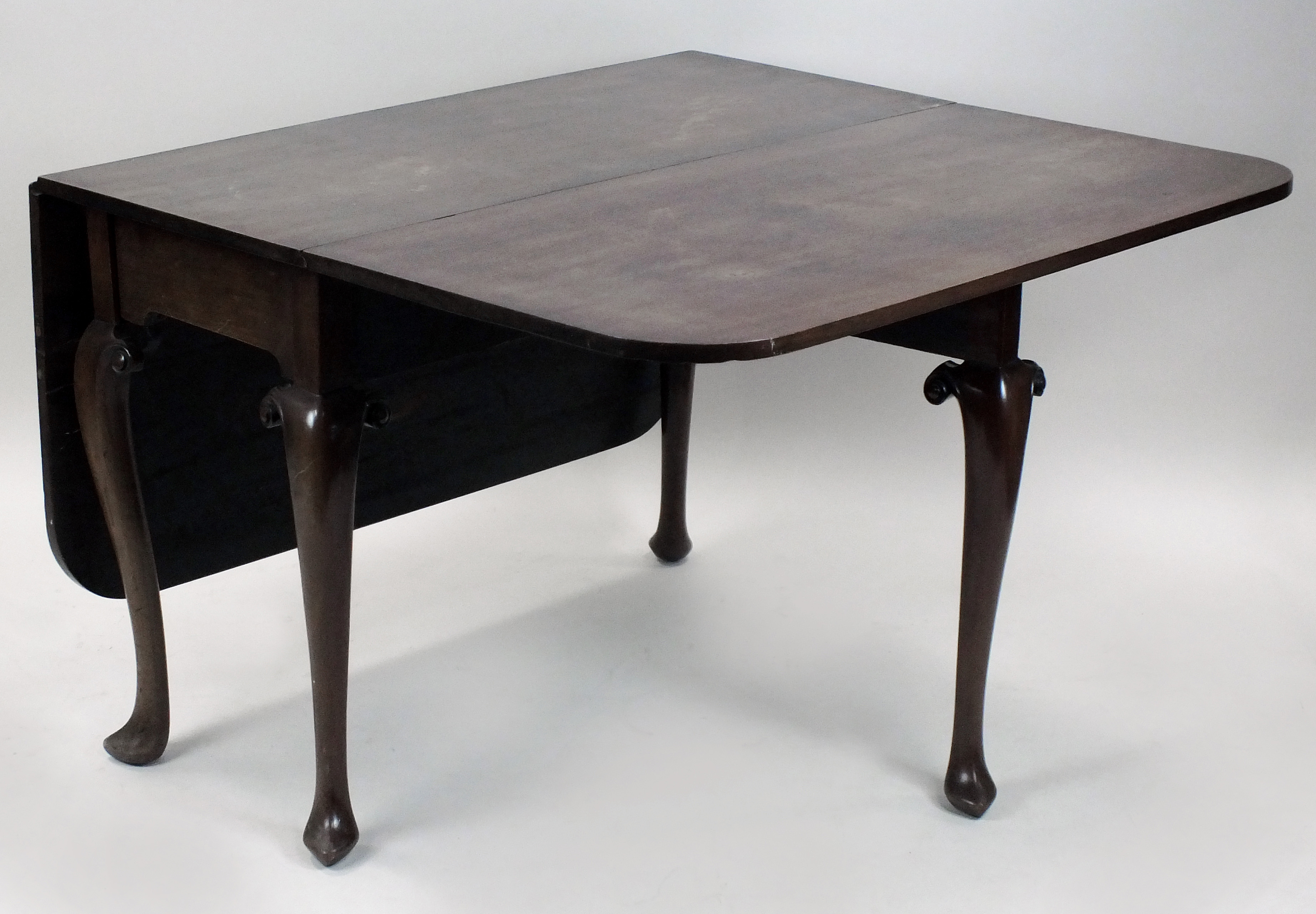 An early George III mahogany drop-leaf single gate leg action dining table the rectangular twin