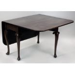 An early George III mahogany drop-leaf single gate leg action dining table the rectangular twin