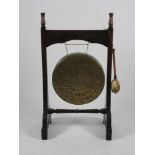 A Victorian Gothic oak dinner gong, third quarter 19th century with turned finials,