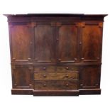 A William IV mahogany break front triple wardrobe,