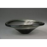 A pale green studio glass bowl, mid 20th century, the bowl with slightly undulating rim,