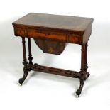 A Victorian figured walnut and inlaid games and work table, circa 1860,