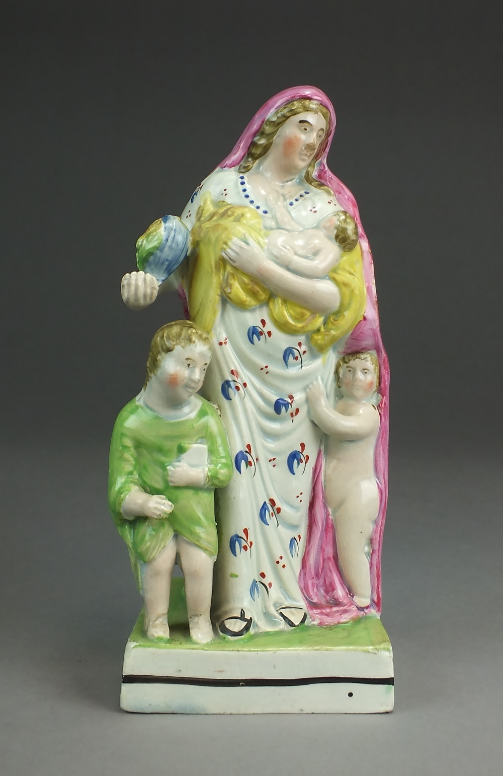 A Staffordshire pearlware figure of Charity, circa 1800-20,