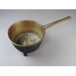 A brass skillet, 18th century,