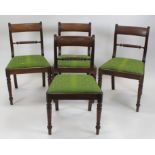 A set of four Regency mahogany and ebony strung bar and rope back dining chairs,