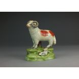 A Staffordshire ram and ewe group, circa 1820, modelled on a stepped base, unmarked, 11.