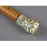 A George III walking cane, 18th century, with ivory and pique work handle, lacking ferrule,