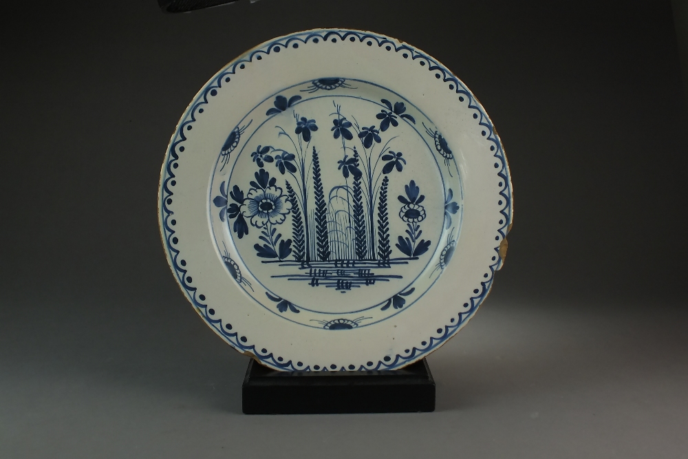 A large blue and white delft charger,