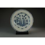 A large blue and white delft charger,