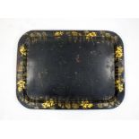 A tole peinte tray, 19th century, of rounded rectangular form,