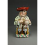 A Yorkshire toby jug, early 19th century, painted in bright colours, typically modelled,